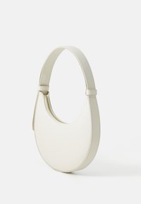 White leather shoulder bag with a rounded shape, a smooth surface, and a zip closure. Features a wide, flat strap for comfortable carry.