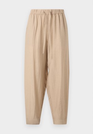 Pantalon beige coupe large avec taille élastique et cordon, fabriqué en tissu léger texturé, avec des jambes fuselées.