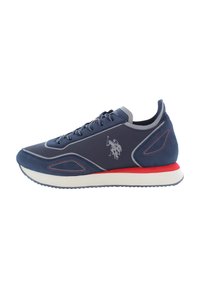 Navy athletic shoe featuring a suede and mesh upper, textured paneling, grey accents, red midsole, and embroidered logo detail on the side.