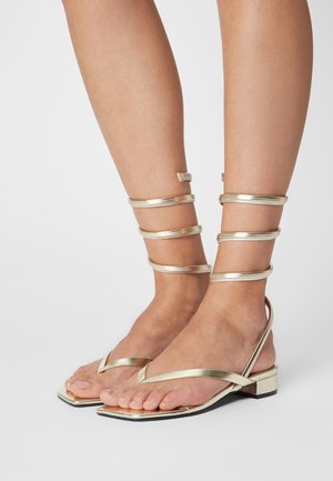 Monki Sandaler m/ tåsplit - gold-coloured