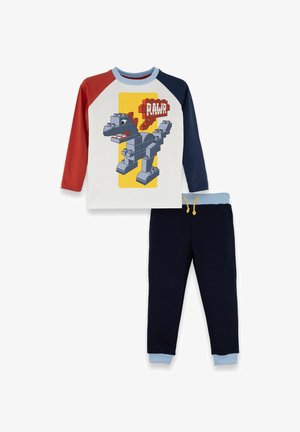 Langärmliges Oberteil mit roten und marineblauen Ärmeln, Dino-Baustein-Grafik mit dem Aufdruck "RAWR" und einer marineblauen Hose mit hellblauen Bündchen und Taillenbund.