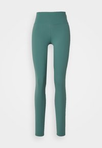 Turkosa högmidjade leggings gjorda av stretchigt tyg. Slät textur utan synliga mönster eller detaljer, utformade för komfort och flexibilitet.