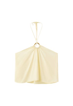 Haut dos nu couleur crème avec un anneau en bois à l'encolure et des liens en tissu qui se nouent derrière le cou.