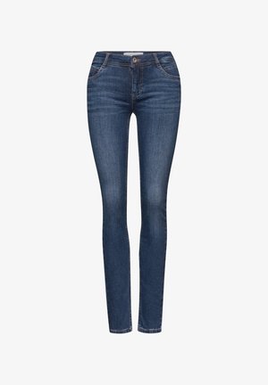 Jeans skinny blu scuro in denim, con un classico design a cinque tasche, passanti per cintura e una texture leggermente sbiadita.