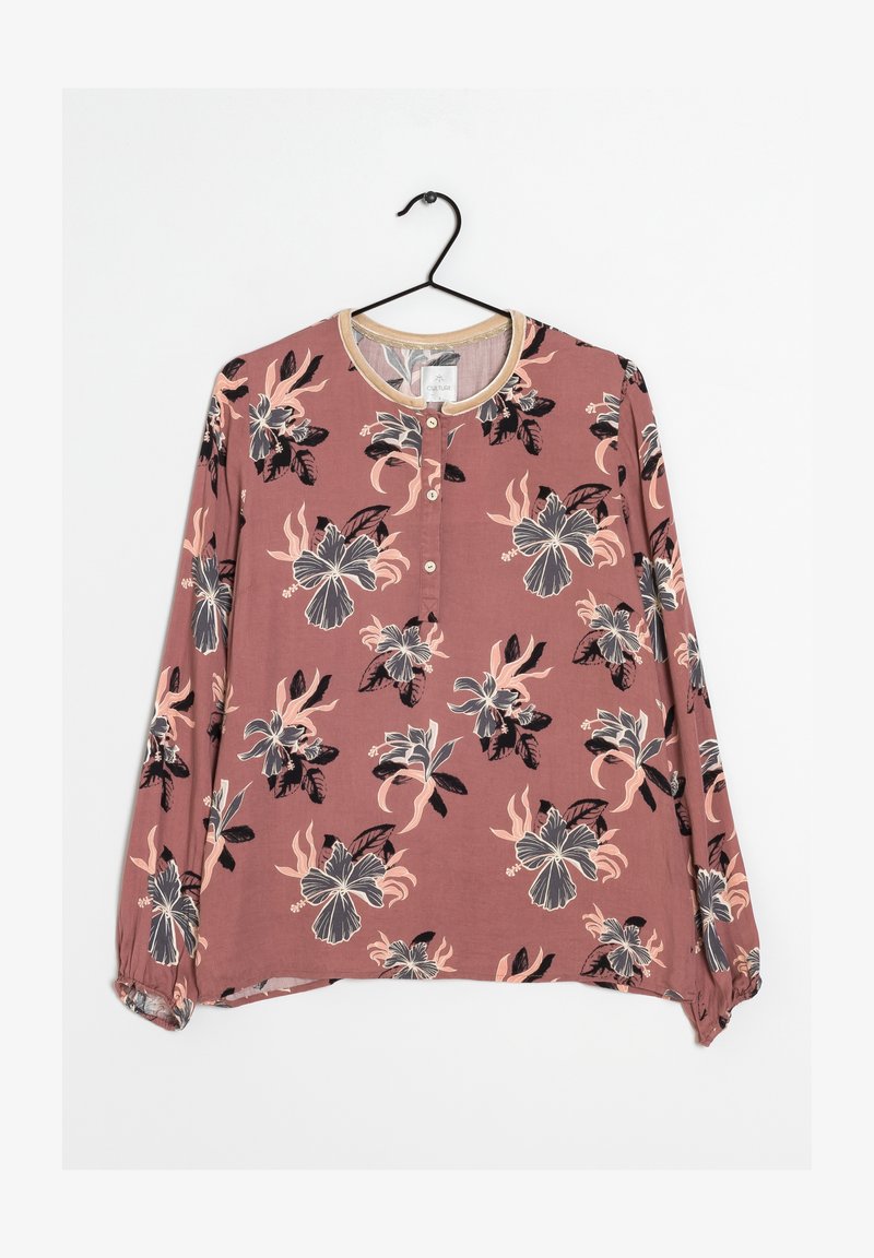 Langärmlige Bluse in Mauve mit Blumenmuster. Verfügt über einen runden Ausschnitt, Knopfverschluss und elastische Ärmelbündchen. Weicher Stoff mit leichtem Griff.