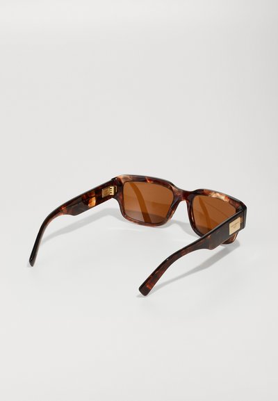 Brown tortoiseshell sunglasses with rectangular frames and brown tinted lenses. Features gold hardware accents on the temples.