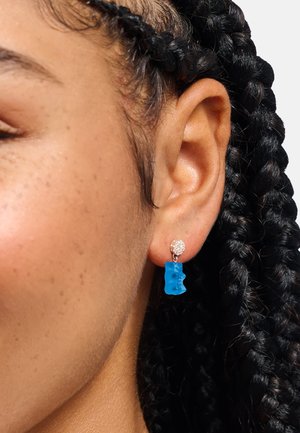 Blaue Ohrringe in Form von Gummibärchen mit funkelndem rundem Steckverbinder, gestaltet aus verspieltem Harz für ein lustiges Accessoire.