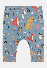 Leggings de algodão azuis com um padrão divertido de animais, incluindo raposas, ursos e corujas, com detalhes em laranja e amarelo e punhos canelados.