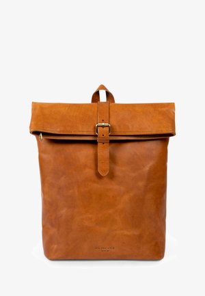Brown leather backpack with a roll-top design, secured by a metal buckle. Features pronounced texture and logo at the bottom.