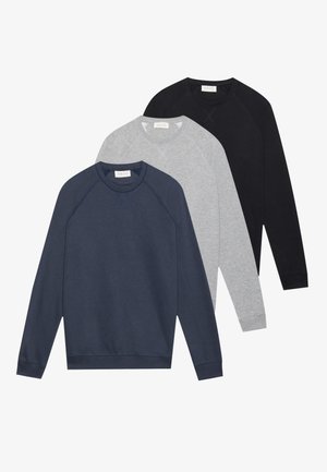 Three long-sleeve crewneck sweatshirts in navy, light gray, and black, layered and laid flat on a white background.