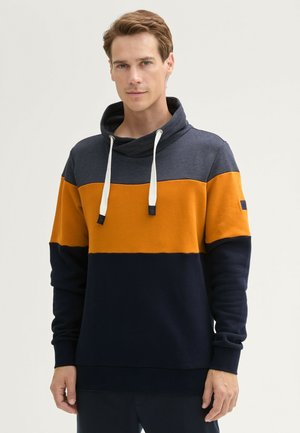 Kleurblok hoodie met een funnel neck, met marineblauwe, oranje en grijze strepen. Gemaakt van zachte stof met een losse pasvorm en trekkoorden.