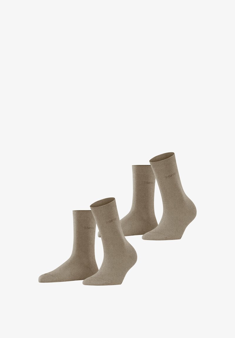Chaussettes en coton beige, longueur mi-mollet, avec une texture douce. Présente un logo discret près de la cheville et une forme classique. Ensemble de quatre paires.