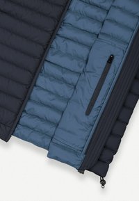 Quilted jacket featuring a navy and blue color scheme, with a smooth texture, zippered pocket, and a cinch cord at the hem.