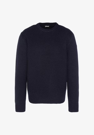 Granatowy sweter dzianinowy z teksturowanym wzorem, okrągłym dekoltem, długimi rękawami oraz ribbowymi mankietami i dołem. Wykonany z miękkiego materiału.