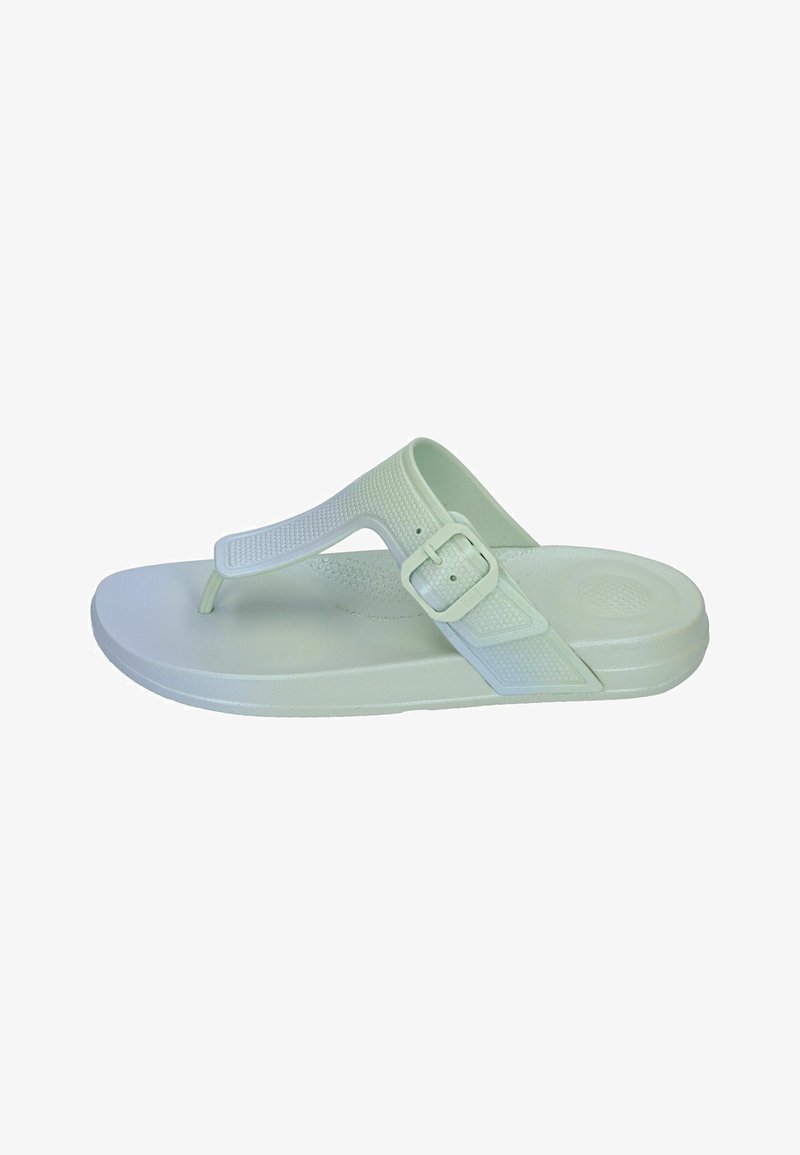Light green flip-flop sandal with textured strap, adjustable buckle, and a flat sole. Smooth material with a minimalistic design.