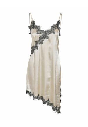 Crème satijnen slipjurk met zwarte kanten rand langs de halslijn, zoom en asymmetrische randen, voorzien van dunne spaghetti bandjes.