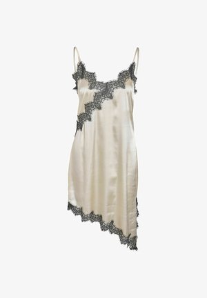 Crème satijnen slipjurk met zwarte kanten rand langs de halslijn, zoom en asymmetrische randen, voorzien van dunne spaghetti bandjes.