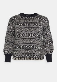 Pull en tricot noir et blanc avec des motifs géométriques et en losange, col rond côtelé, poignets et manches longues légèrement bouffantes.