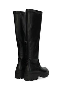 Svarta knähöga stövlar i slätt läder, med rund tå, tjock gummisula och sidodragkedja för justering.