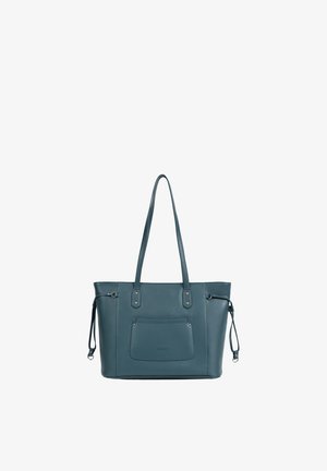Sac cabas en cuir bleu sarcelle avec longues bandoulières, poche avant, cordons latéraux et ferrures argentées sur fond blanc.
