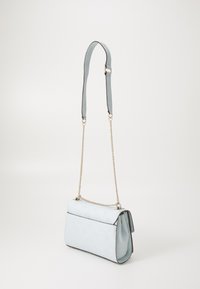 Light blue leather handbag with embossed pattern, chain strap, and rectangular shape. Features a flap closure and contrasting trim.