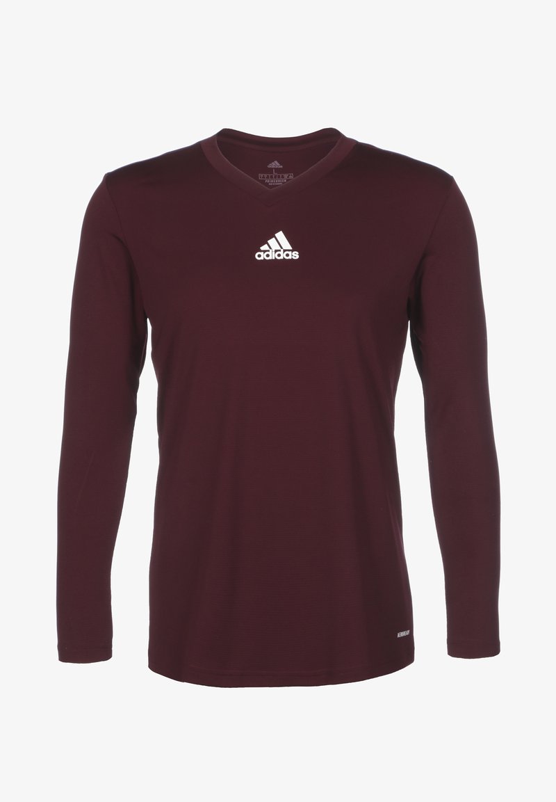 Maroon long-sleeve shirt with a v-neck design. Features the Adidas logo in white on the upper left chest. Smooth fabric texture.
