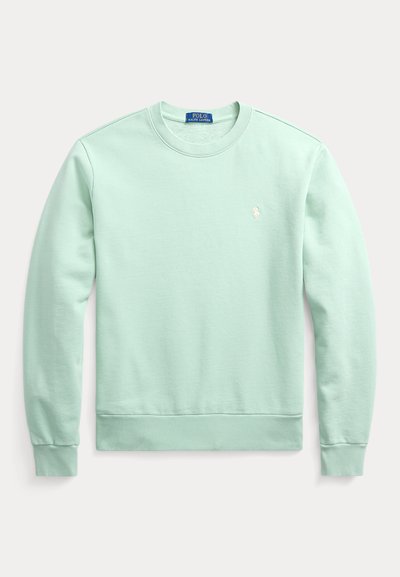 Sweatshirt verde menta com decote redondo, punhos e bainha canelados, apresentando um pequeno logótipo bordado no peito. Material macio em mistura de algodão.