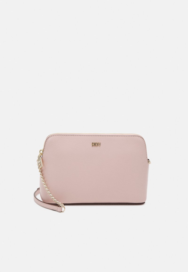 DKNY BRYANT DOME CROSSBODY Across body bag lotus/pink Zalando