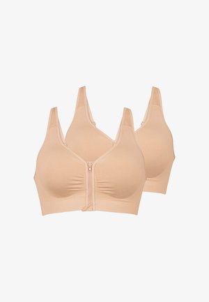 Due reggiseni beige senza cuciture, senza fili, con zip frontale e spalline larghe, mostrati su sfondo bianco.