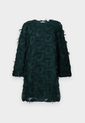 Dunkelgrünes Kleid aus strukturiertem, fransigem Stoff mit Karomuster. Lange Ärmel und runder Ausschnitt, aus leichtem Material.