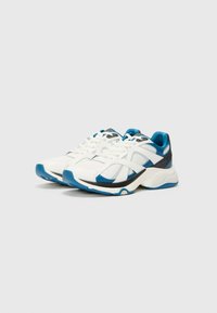 White athletic shoes with blue accents, featuring a mesh and synthetic upper, padded collar, textured sole, and lace-up closure.