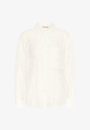 Balta marškinių tipo palaidinė su gėlių raštu, turi apykaklę ir kairėje krūtinės pusėje kišenę. Audinys atrodo lengvas ir permatomas.