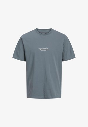 Szara koszulka z krótkim rękawem wykonana z bawełny, z okrągłym dekoltem i nadrukiem z przodu, który mówi "Originals Studio" w białym tekście.