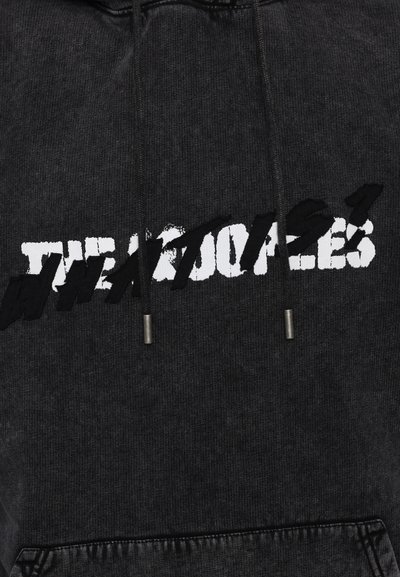 Black hoodie featuring a bold, distressed white text design on the front. Drawstring at the neck with metal tips and ribbed hem.