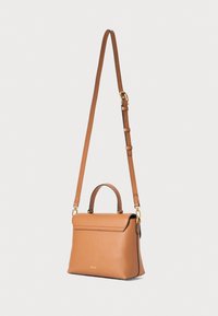 Brown leather handbag with a structured design, featuring a flat top flap, short handle, and adjustable shoulder strap. Gold hardware accents.