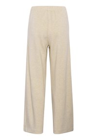 Světle béžové široké kalhoty vyrobené z měkké, strukturované tkaniny s elastickým pasem. Mají hladký povrch a ležérní design.