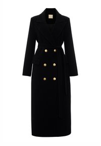Czarny wełniany płaszcz o długim, dopasowanym kroju. Posiada duże złote guziki, pasek i podwójne kieszenie; klapki w szpic. Gładka faktura.