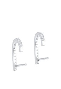 Sølvfarvede øreringe med en buet, langstrakt form, der har en række klare krystaller og prikket detaljer langs siderne.