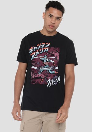 Black cotton t-shirt featuring a colorful comic book style print with a character in a dynamic pose and Japanese text accents.