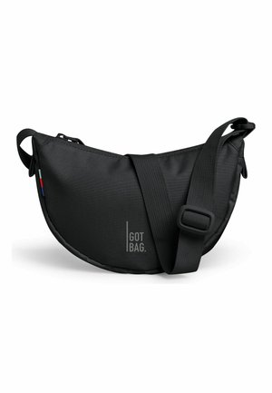 Sac bandoulière noir en forme de croissant avec sangle réglable, fermeture éclair et logo "GOT BAG" sur le devant.