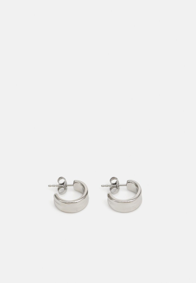 Silver hoop earrings made of metal, featuring a smooth, glossy surface and a circular design with a secured post back.