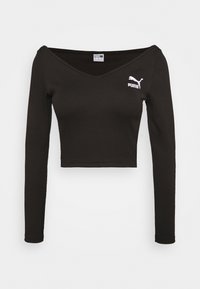 Top corto nero a maniche lunghe in tessuto a costine. Presenta una scollatura a V e un logo Puma bianco sul petto sinistro.