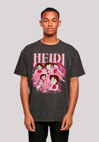 Black oversized t-shirt featuring a colorful graphic of animated characters from "Heidi," with bold text above and a soft texture.