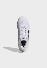 White athletic shoe with mesh upper, featuring black accents and three stripes design. Rounded toe, lace-up closure, and cushioned sole.
