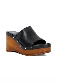 Black leather wedge sandals with an open toe, wooden platform, silver studs along the edge, and a curved shape for a unique design.