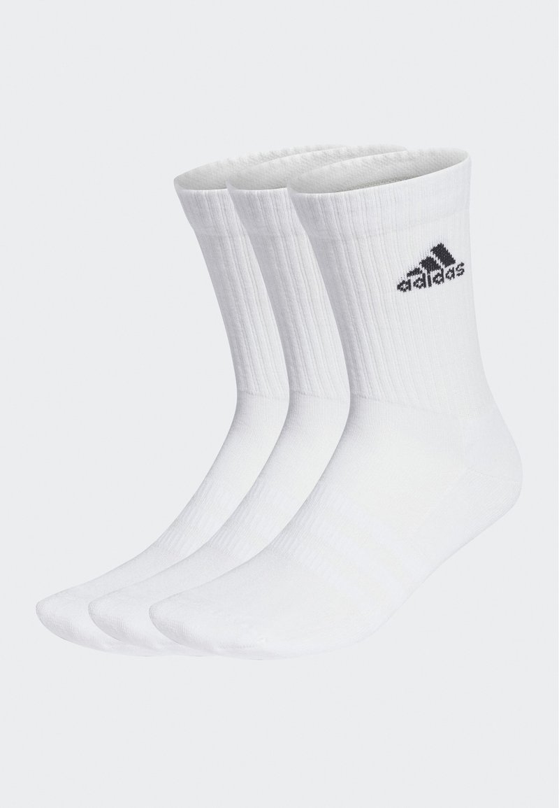 White crew-length socks with ribbed texture and three distinct pairs. Each sock features a black adidas logo near the top.