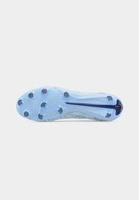 Light blue soccer cleat sole with seven round studs and a dark blue Nike swoosh running along the foot arch.