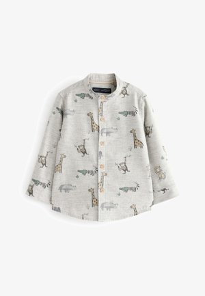 Chemise enfant à manches longues gris clair avec boutons en bois, ornée d'imprimés ludiques de singes, girafes, crocodiles, rhinocéros et lions.