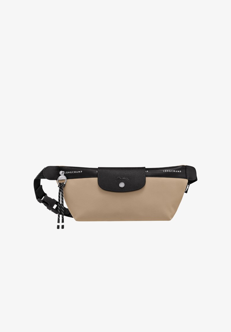 Beige nylon waist bag with a black textured leather flap, silver hardware, adjustable strap, and logo details on the top.