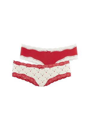 Zwei Paar Damenunterwäsche mit Spitzenbesatz, eines uni rot mit weißer Spitze, eines weiß mit roter Spitze und einem roten Rentiergesichtsmuster.